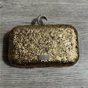 New without tags. Jewell Gold Glitter Clutch with Ring Attachment.